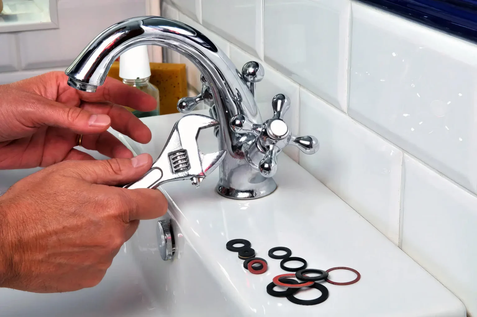 Plumber maintaining a bathroom faucet in Hawthorne
