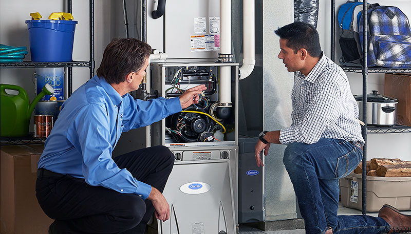 Technician evaluating a furnace for repair or replacement in Hawthorne