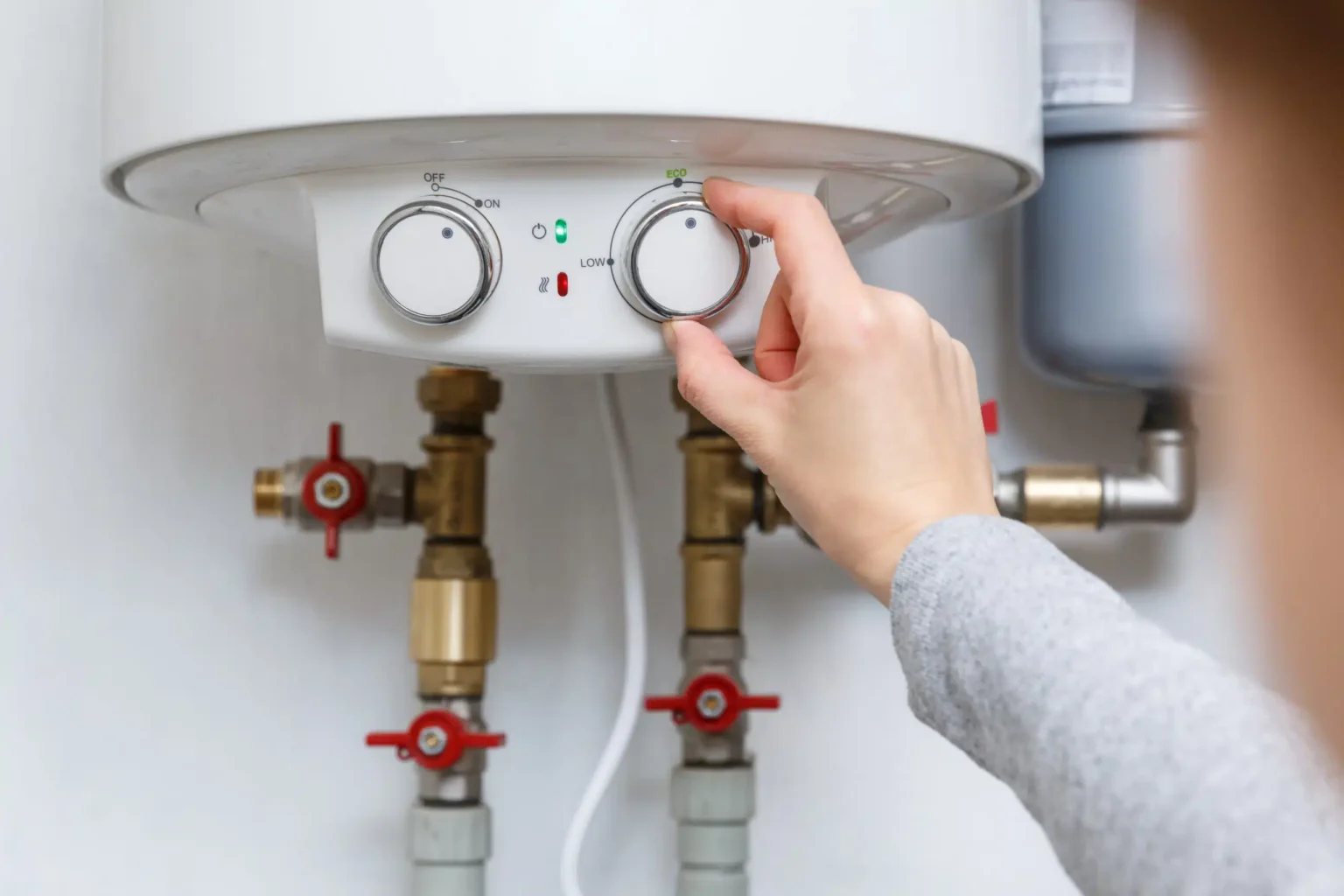 Technician adjusting a water heater in Hawthorne